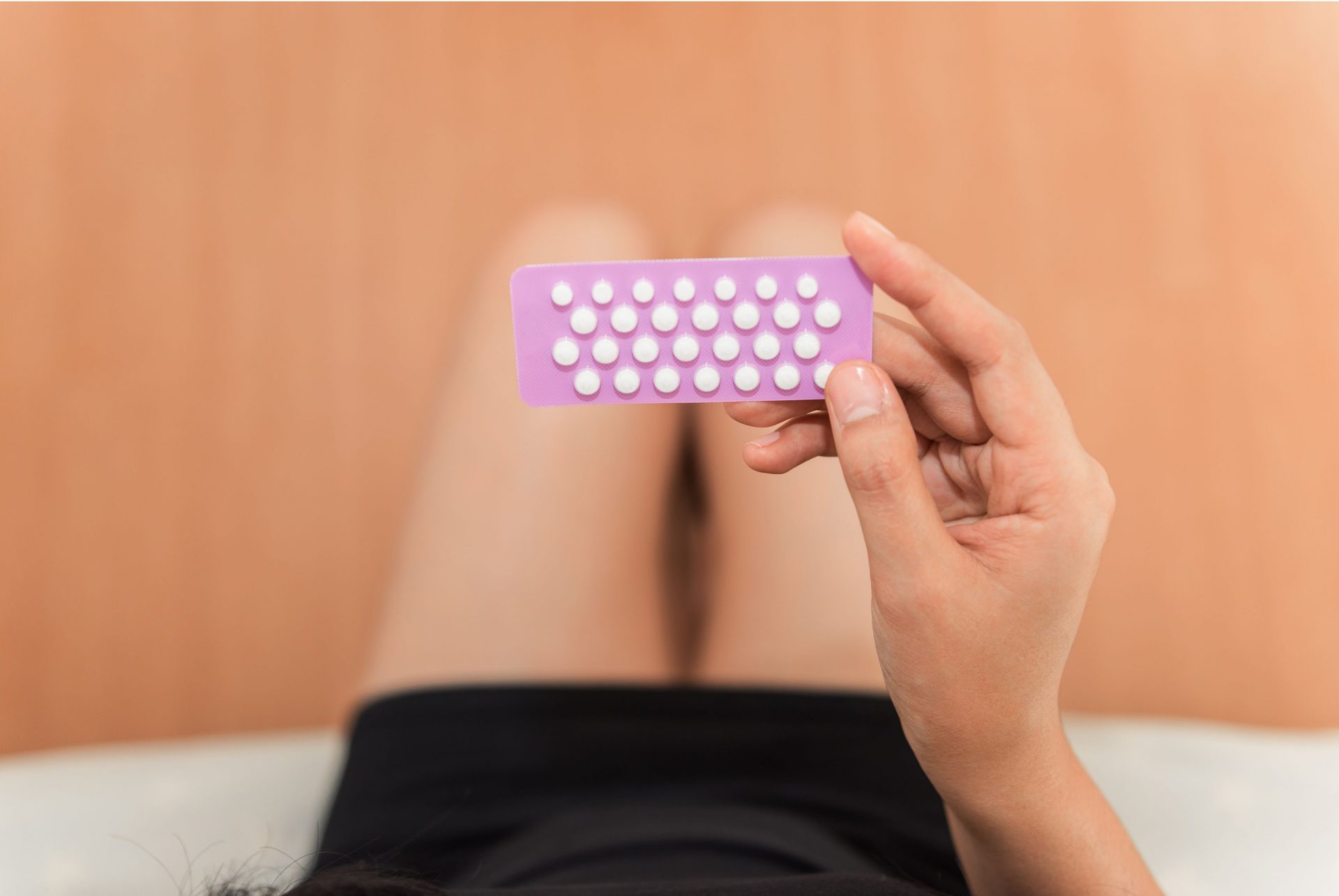 Woman holding contraceptives