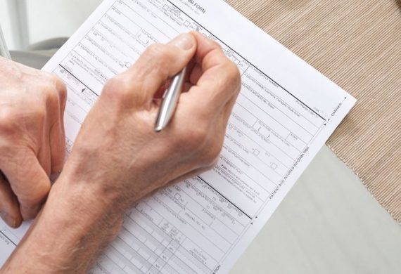 Person filling up a Heart Wellness Programme Form