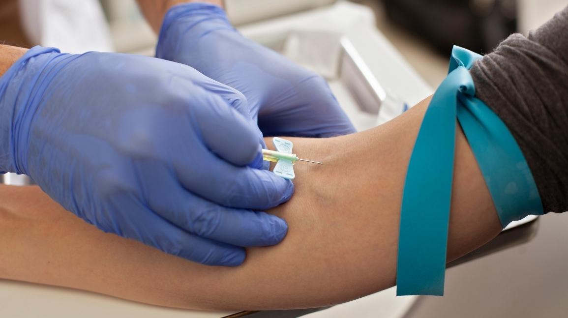 Person administering cholesterol test