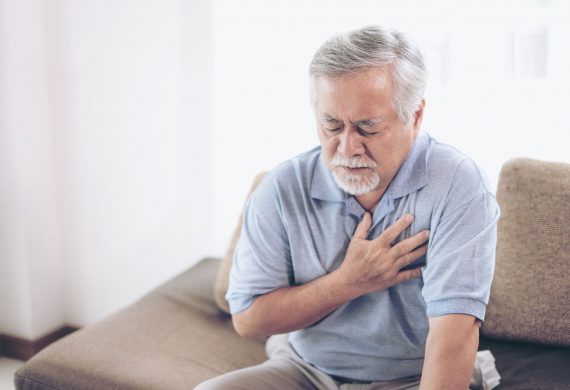 man experiencing chest pain