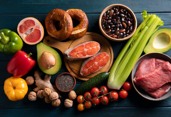 Healthy foods like salmon and avocado to increase good cholesterol.