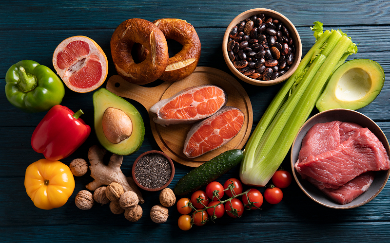 Healthy foods like salmon and avocado to increase good cholesterol.