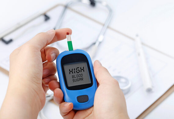 Person checking high blood sugar levels with glucose monitor.