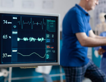 Patient undergoing clinical monitoring during cardiac rehabilitation training session.