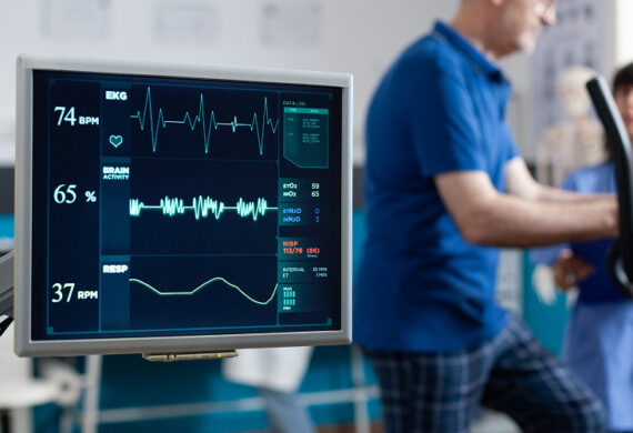 Patient undergoing clinical monitoring during cardiac rehabilitation training session.