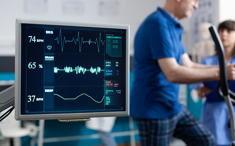 Patient undergoing clinical monitoring during cardiac rehabilitation training session.