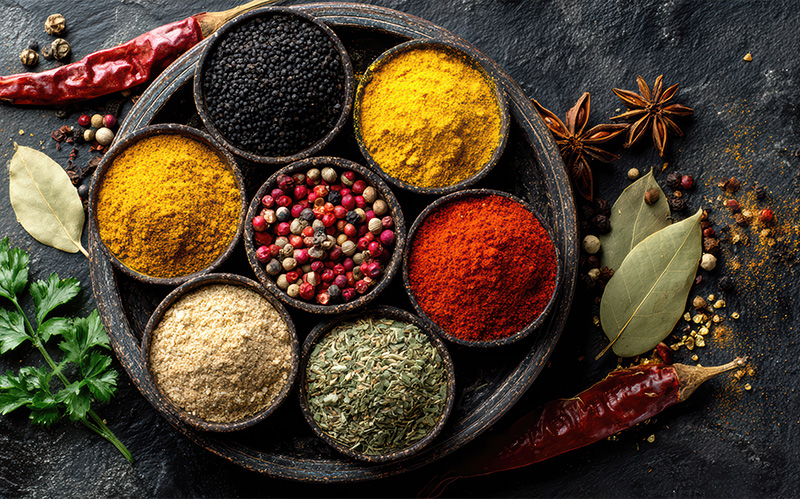 Variety of spices arranged in bowls.