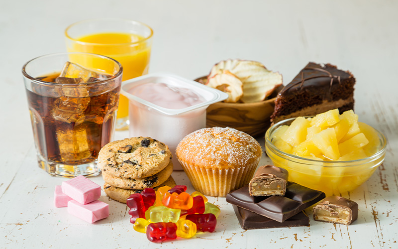Assorted sweet snacks and desserts on table.